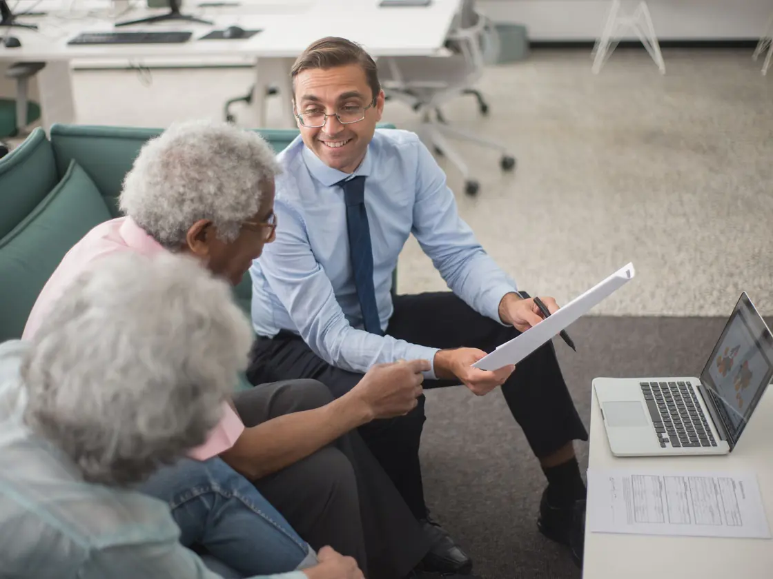 A PolyLine Group advisor explaining life insurance options to a client